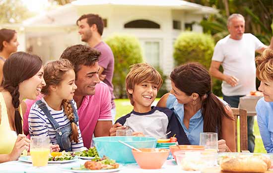 family with young children at an outdoor party